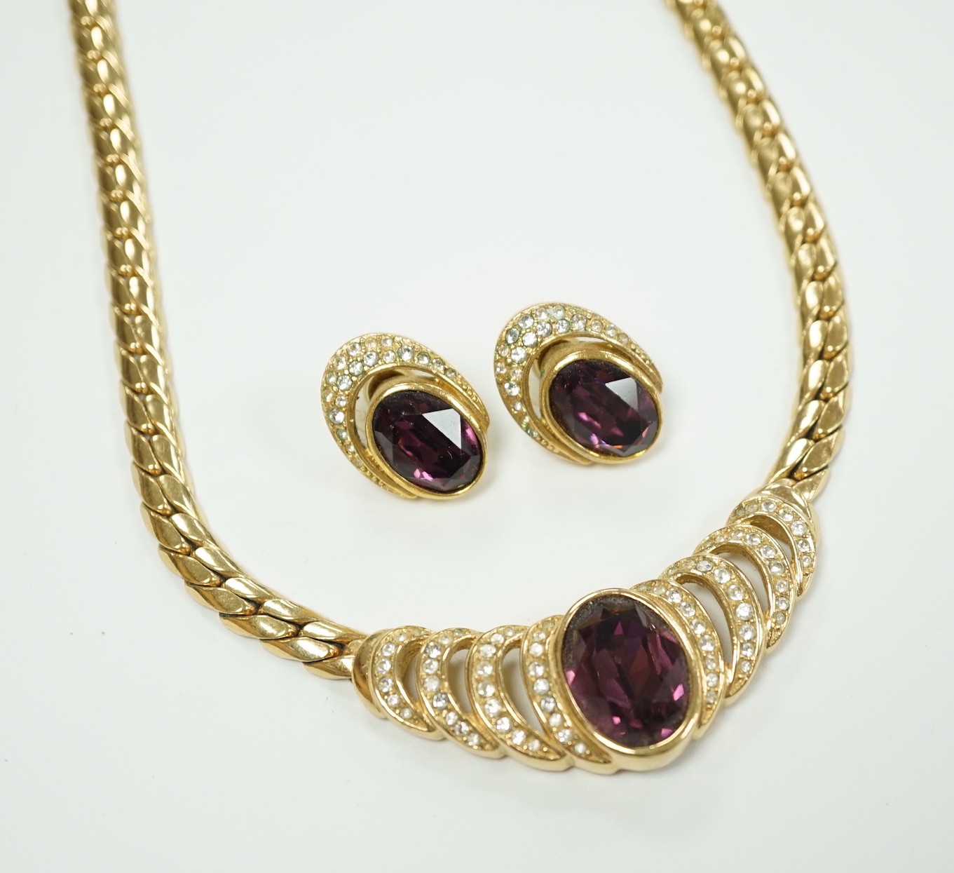 A Christian Dior gilt metal and two colour paste set costume necklace, 36cm and a pair of matching earrings.
